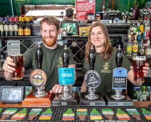 Couple behind bar at pub