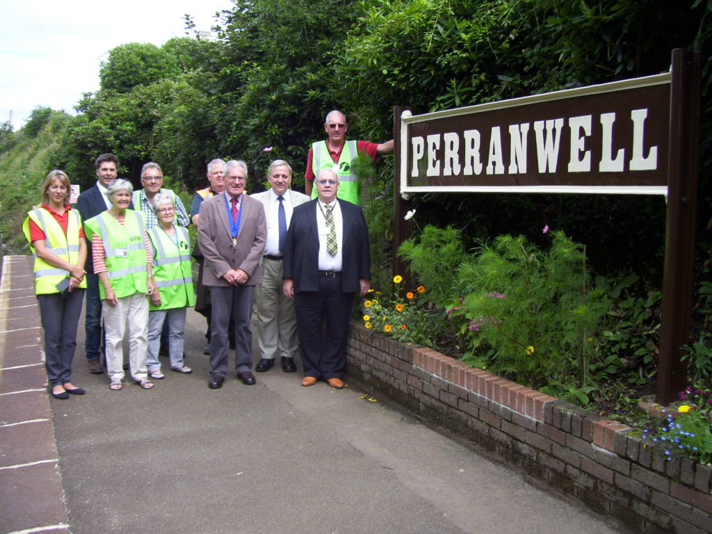 (right to left) Stuart Douglas of the Friends, Cllr Peter Williams, Richard Burningham, Cllr  Graham Brown and Phil Mankee (GWR) with members of the Station Friends