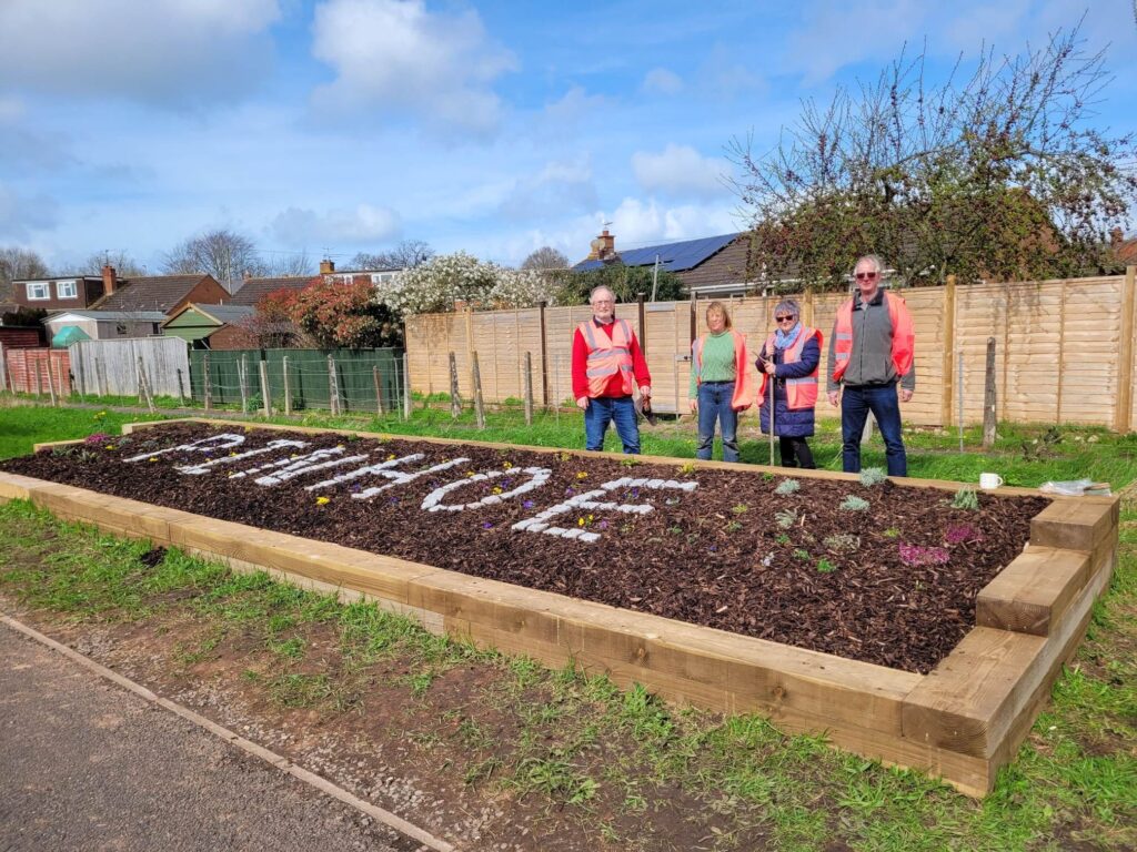 Pinhoe Community Hub volunteers plant up the new sign and garden. Photo - Pinhoe Community Hub