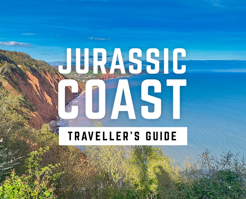 Jurassic Coast Travellers Guide logo with Sidmouth's red cliffs and coastline in background